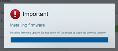 A Firmware Update pop-up reminder not to turn OFF the router during this process.